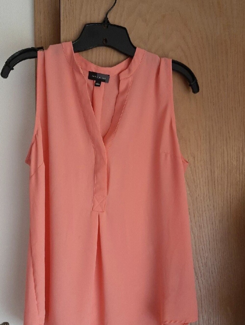 The limited Orange Vneck top Size Large